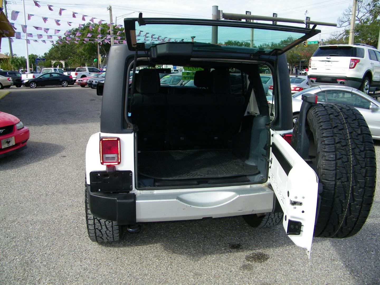 2015 White /Black Jeep Wrangler Unlimited Sahara 4WD (1C4BJWEGXFL) with an 3.6L V6 DOHC 24V FFV engine, Automatic transmission, located at 4000 Bee Ridge Road, Sarasota, FL, 34233, (941) 926-0300, 27.298664, -82.489151 - Photo#12